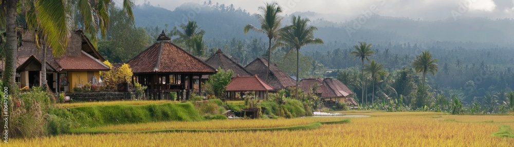 Serene rice fields with traditional houses amidst lush greenery and mountains. Serene rice fields with traditional houses amidst lush greenery and mountains.