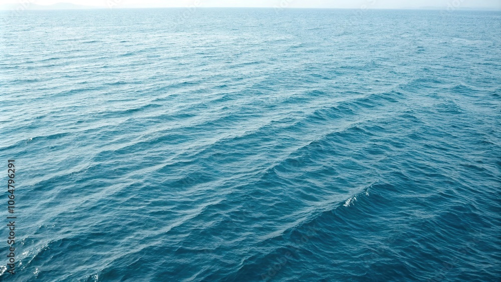 Fototapeta premium Oceanic texture with wavy ripples on a soft blue background, stylized waves, subtle gradient, rippled surface, aqua background