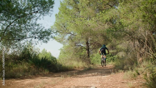 Bicyclist man riding in the mountains