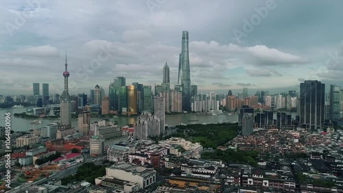 Aerial drone view of Shanghai city center in China,Asia. Huangpu River in Shanghai frome drone. Huangpu River, Huangxiepu or Chunshen River the landmark of Shanghai, Pudong and Puxi. photo