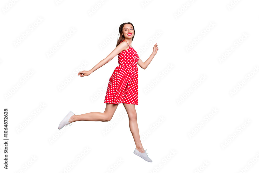 Full size profile side photo of cute youth running wearing dotted skirt dress isolated over teal turquoise green background Full size profile side photo of cute youth running wearing dotted skirt dress isolated over teal turquoise green background