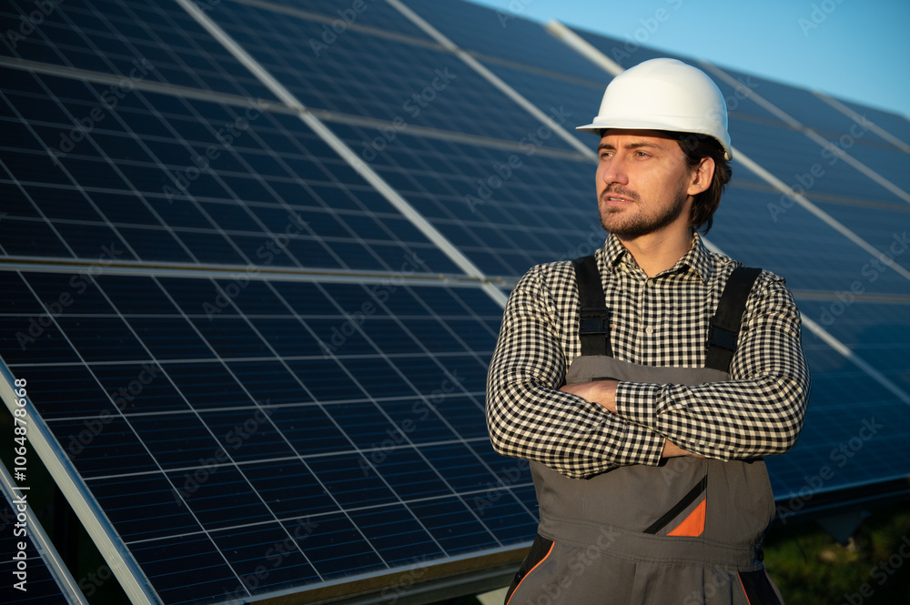 Worker installing solar panels outdoors Worker installing solar panels outdoors