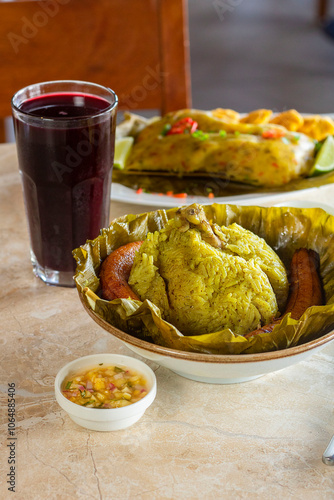 Tradicional juane de gallina regional con maduro frito photo