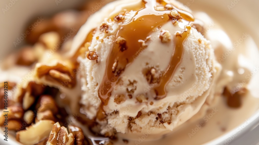 A creamy scoop of ice cream drenched in velvety caramel A creamy scoop of ice cream drenched in velvety caramel