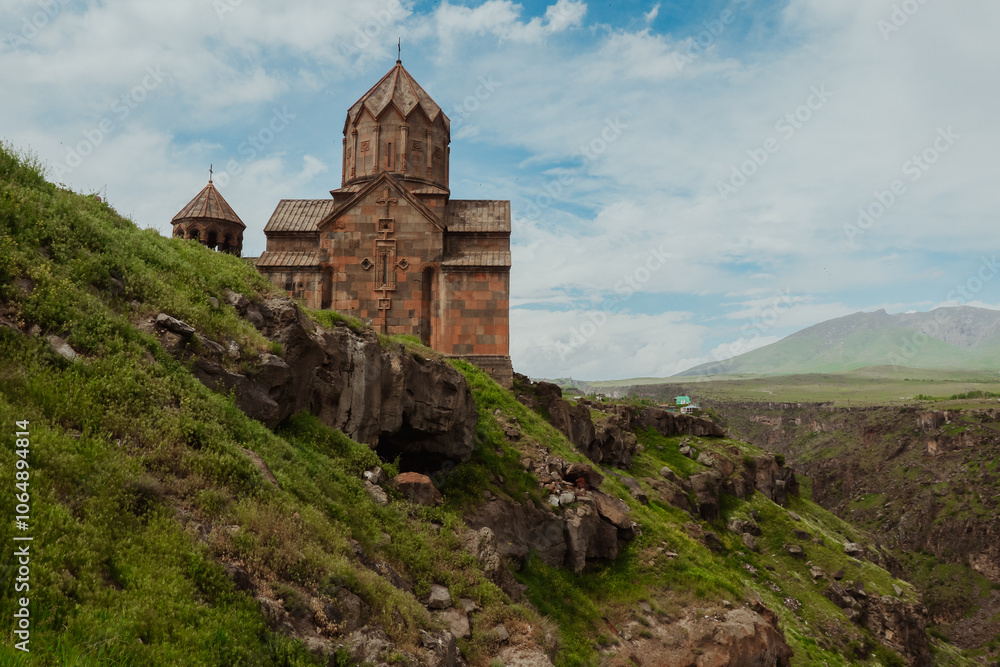 Exploring the ancient Armenian monastery nestled in the mountains on a sunny day Exploring the ancient Armenian monastery nestled in the mountains on a sunny day
