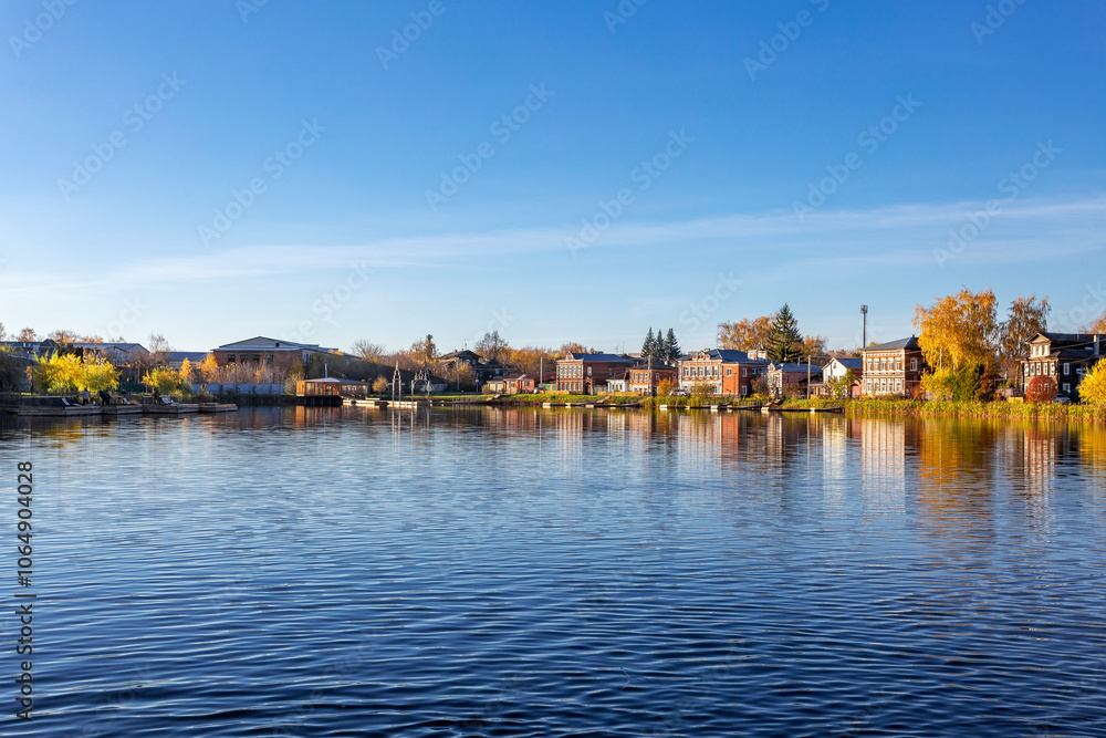 Fototapeta premium Bogorodsk, Nizhny Novgorod region, Russia, Street view of an ancient provincial Russian city on the shore of a lake on a summer evening. An ancient building of artisans, an architectural monument.