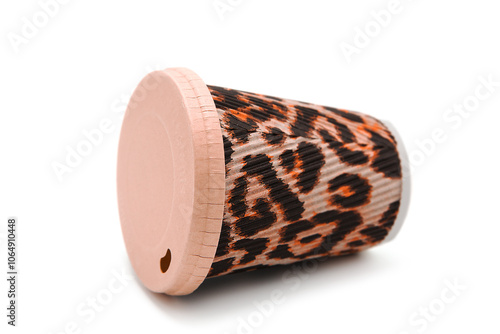 Disposable glass for drinks to go made of organic material isolated on white background. Fashionable tiger or leopard print. Disposable tableware for coffee drinks and tea.	