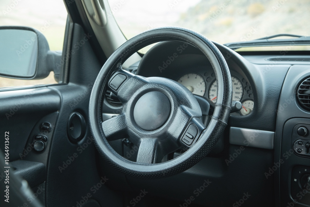 View of car with the steering wheel. View of car with the steering wheel.