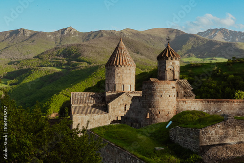 Tatev Monastery offers stunning views amidst the lush mountains of Armenia during golden hour