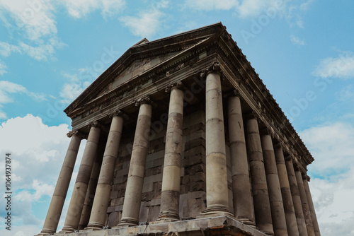 Garni Temple stands majestically under a blue sky in Armenia during a bright day