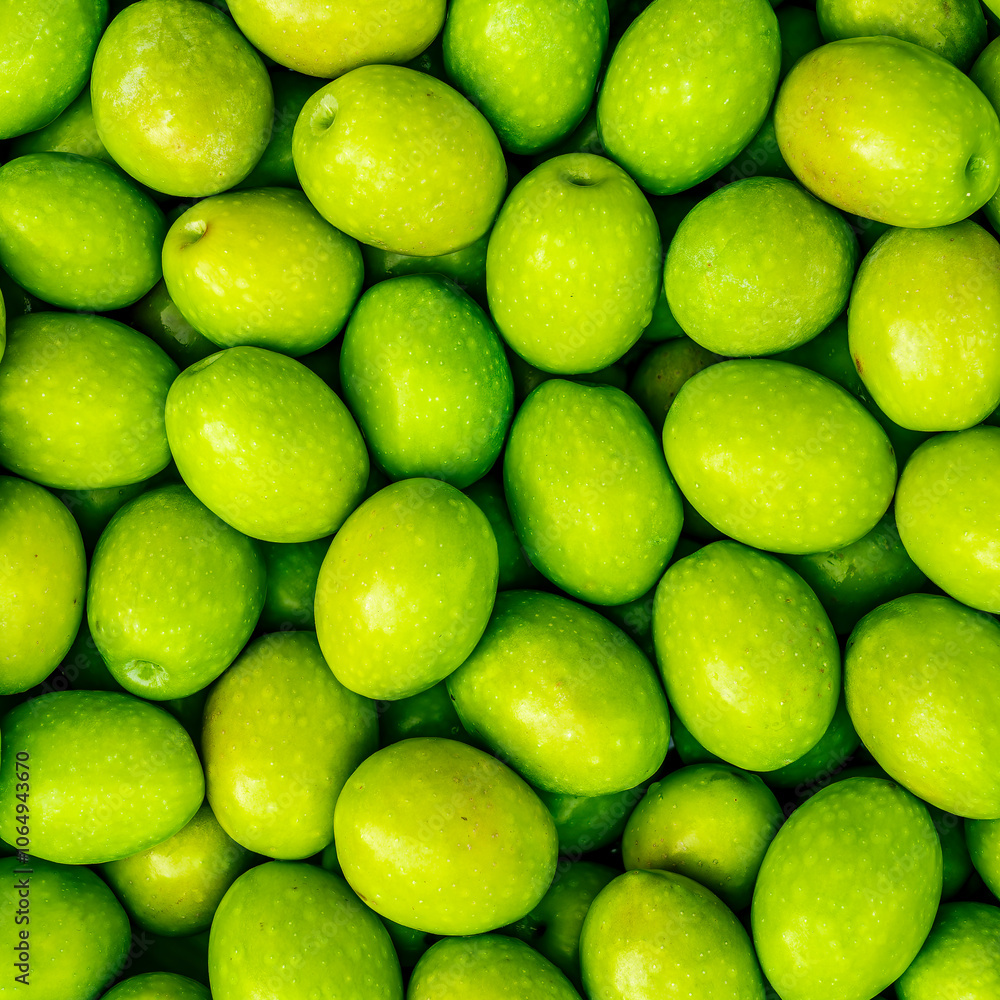 Food background of Fresh Harvested Green Olive for olive oil production pattern texture. Raw fruit for olive oil. Green backdrop of autumn season olive crop Food background of Fresh Harvested Green Olive for olive oil production pattern texture. Raw fruit for olive oil. Green backdrop of autumn season olive crop