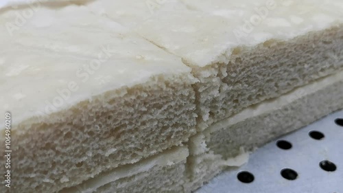 closeup white rice cake (nian gao,New year cake) in the market.Asian rice cake (Chwee kueh) for festival and reunion dinner or family reunion. photo