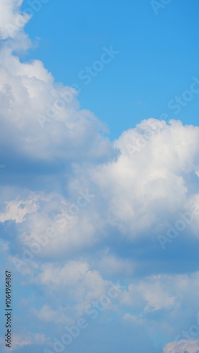 Blue Sky With White Clouds During Spring Time In A Sunny Day. Nice Blue Sky With Sun Beam With Cloudy. Vertical Time Lapse.