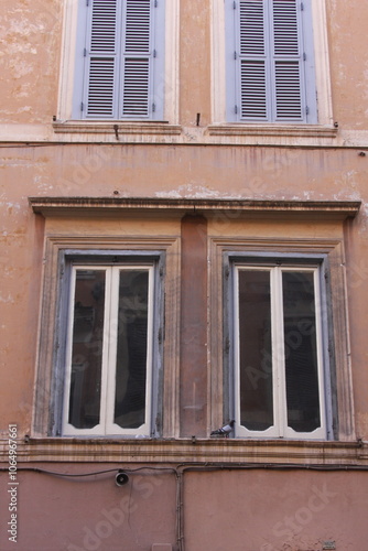 old window with shutters in the centre of Rome