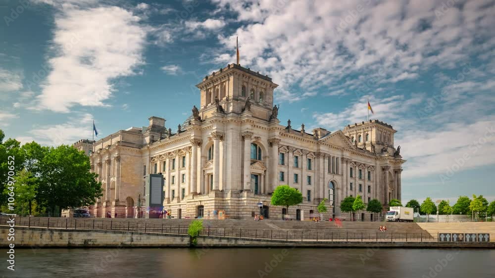 BERLIN, GERMANY - OCTOBER 28, 2024: Scenic view of the Bundestag building near the Spree River showcasing architectural beauty and vibrant greenery BERLIN, GERMANY - OCTOBER 28, 2024: Scenic view of the Bundestag building near the Spree River showcasing architectural beauty and vibrant greenery