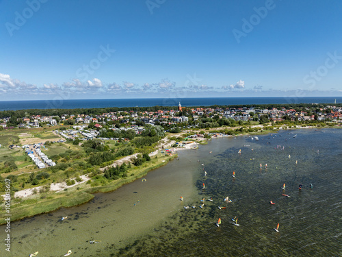 Wallpaper Mural People windsurfing in the sea.  Windsurf board on Puck bay in Jastarnia, Poland, Europe aerial drone photo view. Summer sport learning how to windsurf. Torontodigital.ca