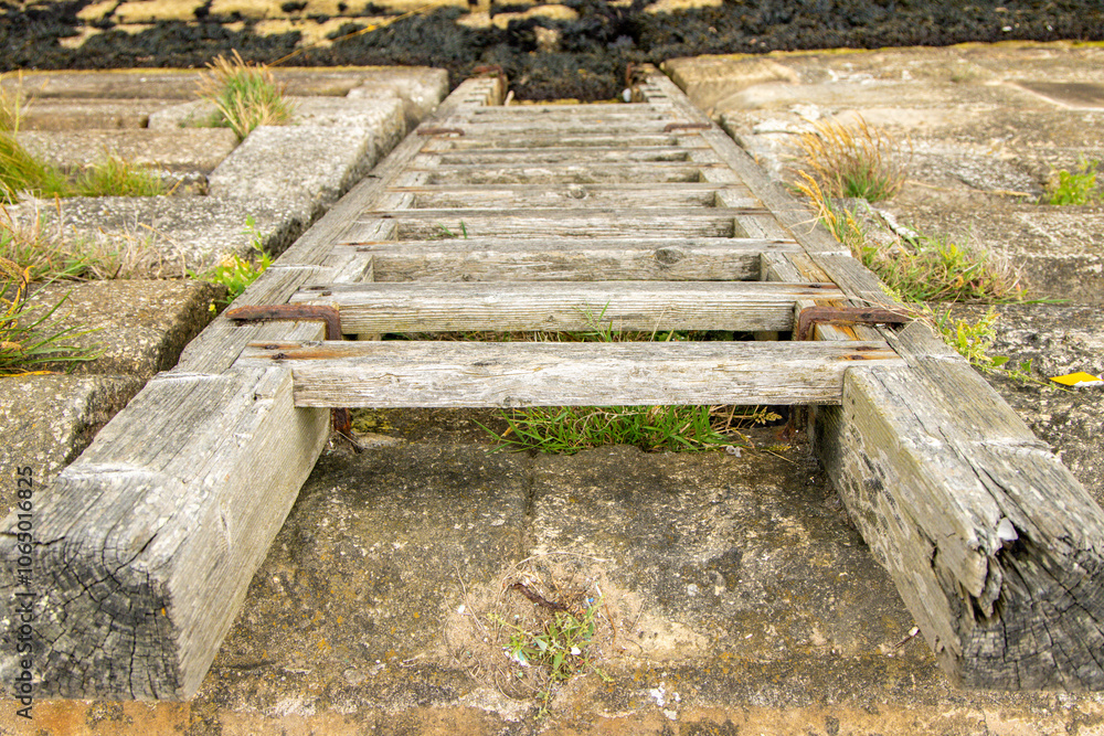 A Harbour Wall Ladder Giving Access To And From The Waters Below A Harbour Wall Ladder Giving Access To And From The Waters Below