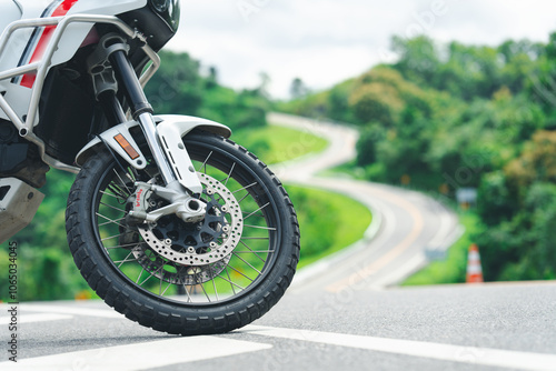 Motorcycle cruising down the road under the golden sunset, basking in the warm glow. A perfect moment to hit the open road with endless possibilities ahead. Space for your personalized message. photo