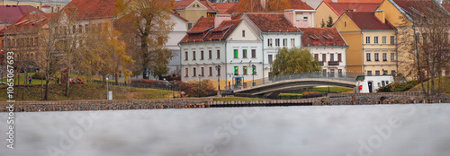 autumn trees and houses in the historical center of Minsk at dawn. Belarus