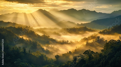 Breathtaking landscape with misty mountains and golden sunlight rays at dawn. photo