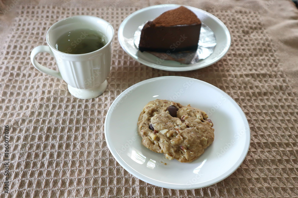 almond cookie , hot tea and chocolate cake almond cookie , hot tea and chocolate cake