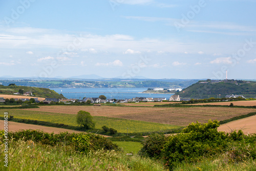 View of Cork Harbour from Templebreedy near Crosshaven, with green fields and the sea in the background, Ireland photo