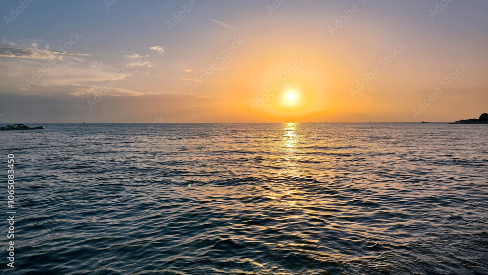 Fototapeta premium sunset by the Adriatic Sea in Poreč, Croatia