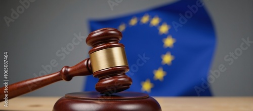 European Union legal scene A gavel stands atop a judges bench with the EU flag rippling in the background photo