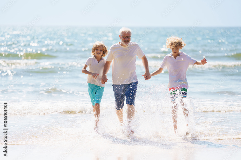 Grandfather and kids on summer beach Grandfather and kids on summer beach
