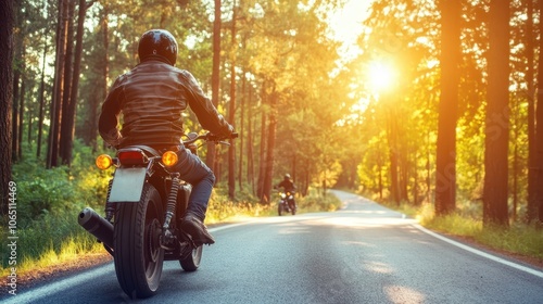 A peaceful yet adventurous moment as a motorcycle cruises down a sunlit forest highway, silhouetted by the trees, symbolizing independence and the call of the open road. photo