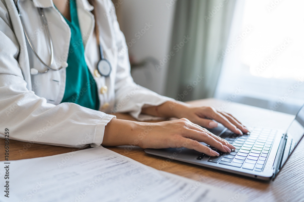 close up of unknown woman doctor work on laptop at office close up of unknown woman doctor work on laptop at office