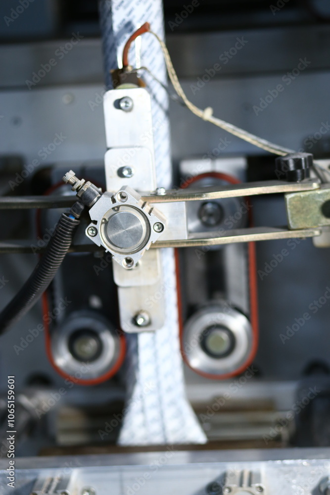 Abstract close-up of a rusty industrial gear with a worn rubber belt