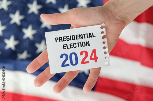 Politics and voting concept. Presidential election 2024 text on white paper over the American flag background