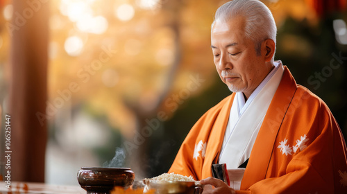 Japanese people celebrate Kannamesai with traditional offering in a serene outdoor setting during autumn photo