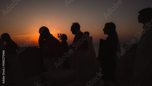 Silhouette of people taking part in religious celebration