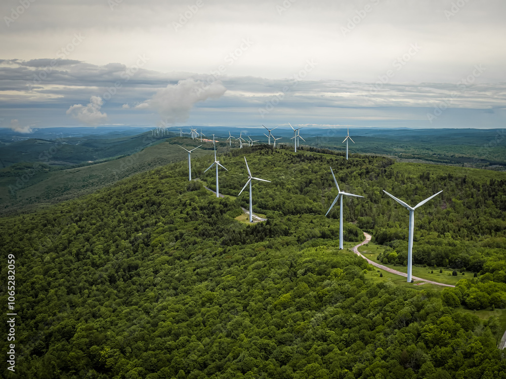 Aerial View of Wind Turbines on Green Mountain Landscape
