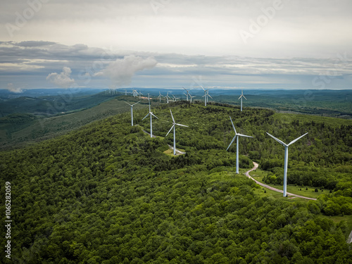 Obraz na płótnie Aerial View of Wind Turbines on Green Mountain Landscape w salonie