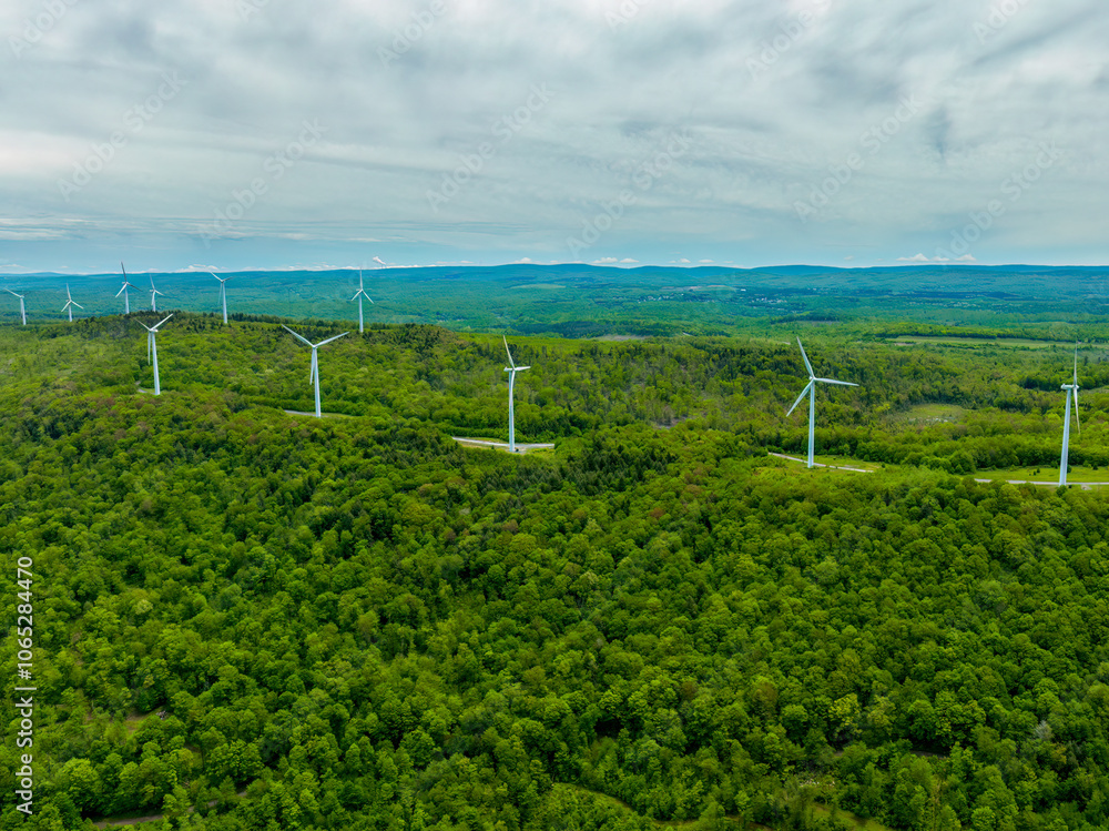 Aerial View of Wind Turbines Across Verdant Hills