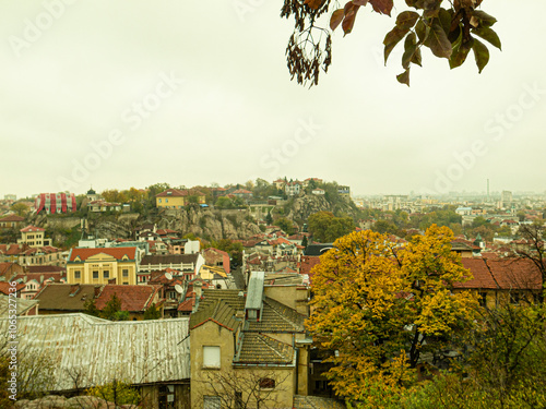 Ancient Roman theater of Philippopolis. It was built during the time of the Roman emperor Marcus Ulpius Trajan. Plovdiv, Bulgaria.Beautiful autumn view of the residential area of ​​Plovdiv, Bulgaria,  photo