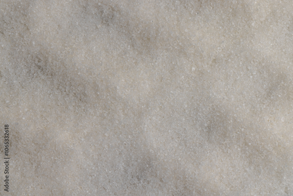 Obraz premium close-up of white granulated sugar on black slate