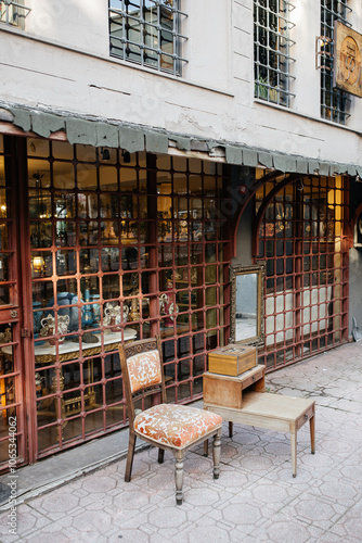 Canvas Print A vintage chair and an old mirror in front of the antique shop, Cucurcuma, Beyoglu, Istanbul, Turkiye