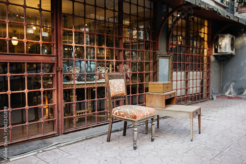 Wallpaper Mural A vintage chair and an old mirror in front of the antique shop, Cucurcuma, Beyoglu, Istanbul, Turkiye.  Torontodigital.ca
