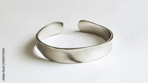 Silver cuff bracelet with minimalist design, showcasing simple yet elegant style