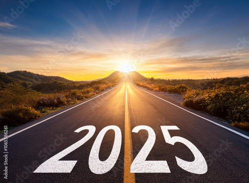 New year 2025. Text 2025 written on the road in the middle of asphalt road at sunset.