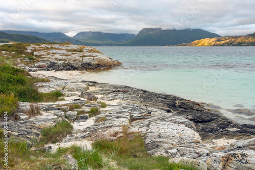 Cloudy summer evening by the calm sea in Sommarøya island in Troms county Northern Norway photo