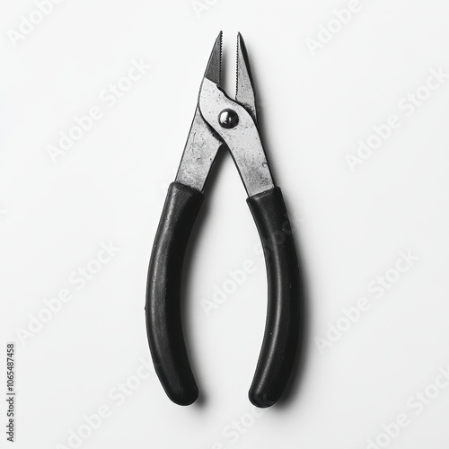 A pair of pliers with rubber-coated handles, showcasing fine details on the jaw and handle photo