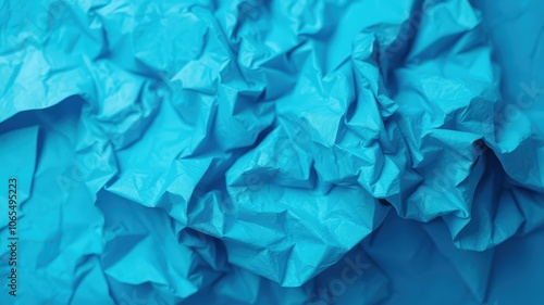 Abstract Texture of Crumpled Blue Paper, Evoking a Sense of Motion and Unpredictability