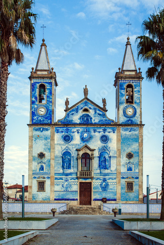 Photography traditional Portuguese church adorned with blue and white azulejos, a hallmark of Portuguese architectural style