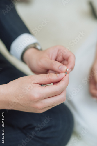 The bride and groom wear wedding rings.