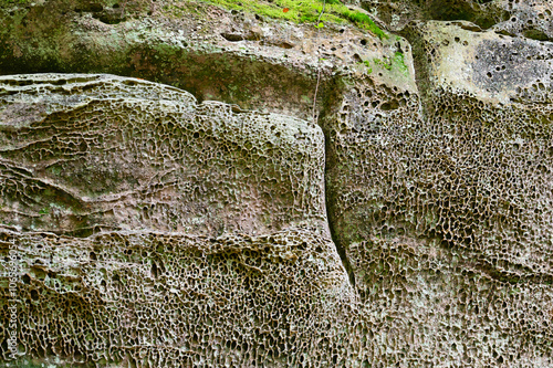 Sandstone, marl, limestone and dolomite rock formation at the Mullerthal in Luxembourg, stone structure close up of erosion processes